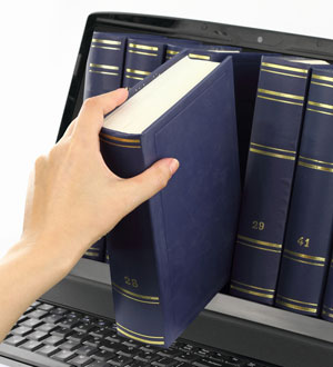 Hand is shelving law books inside a computer screen