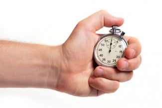 Hand holding stopwatch