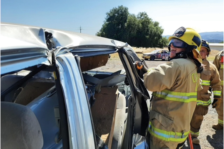 Nicole Smith uses the Jaws of Life to dismantle a car while at the emergency medical services academy