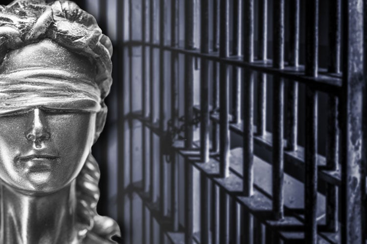 Lady Justice in front of cell block