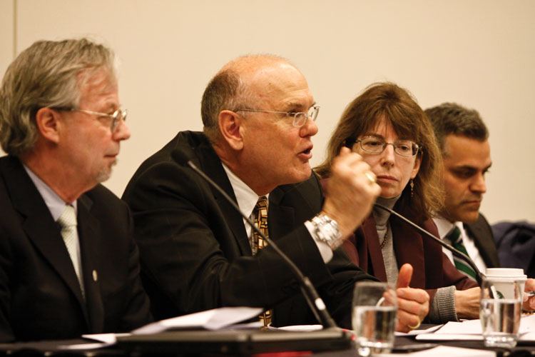 people speaking on a panel