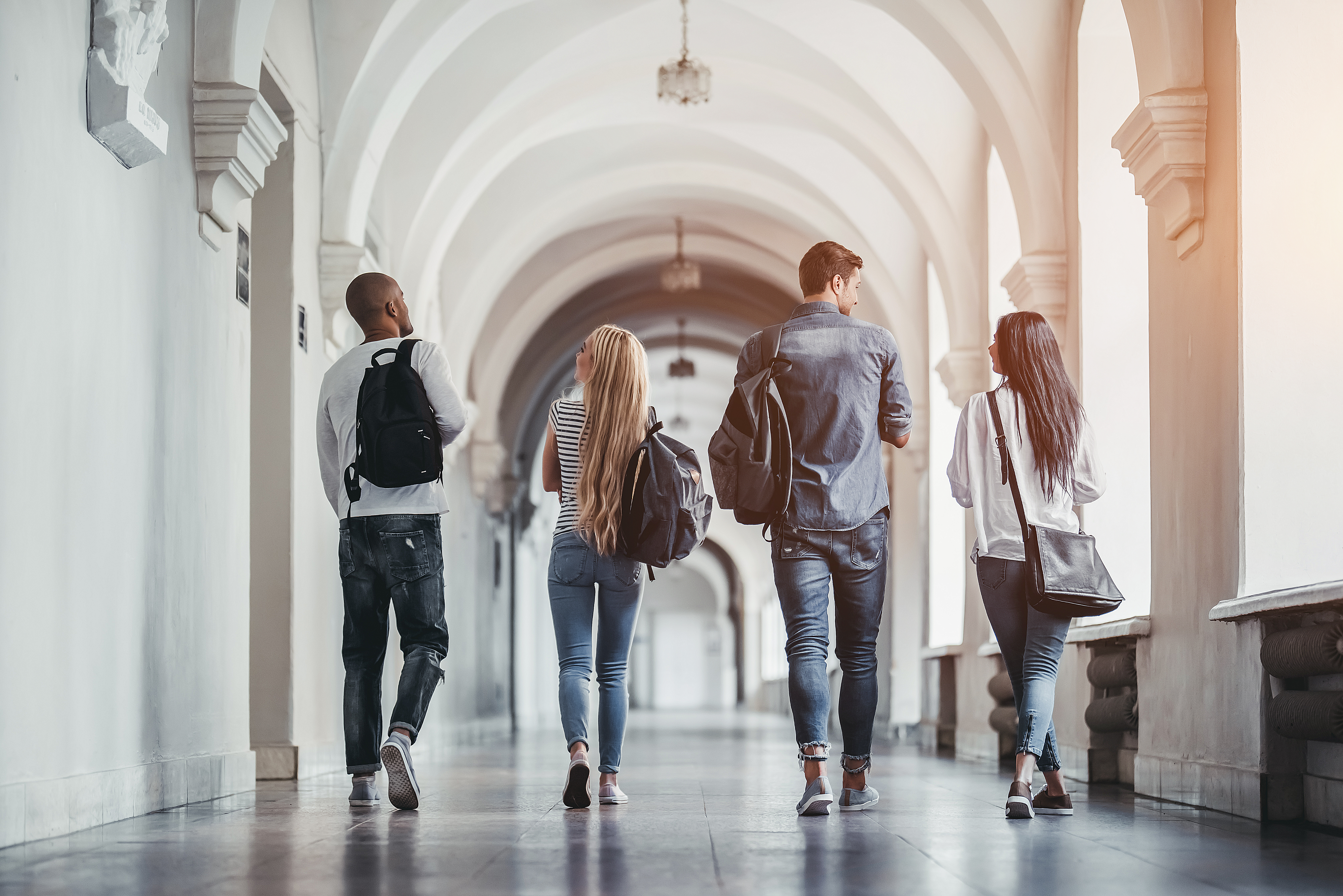Students walking down a university corridor