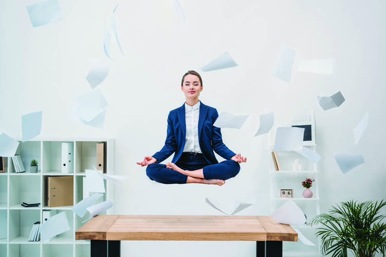 woman meditating in office