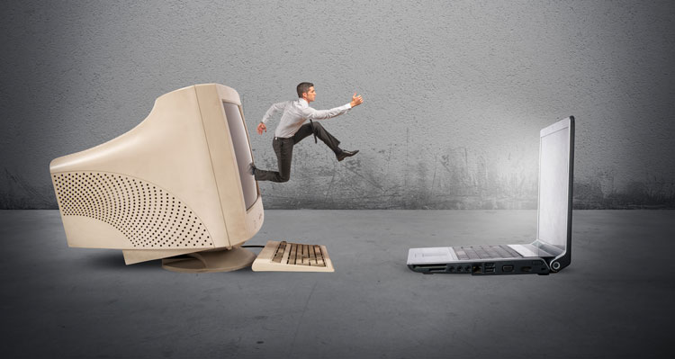 Man jumping from old computer to new computer