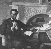 Man in bow tie sitting at desk