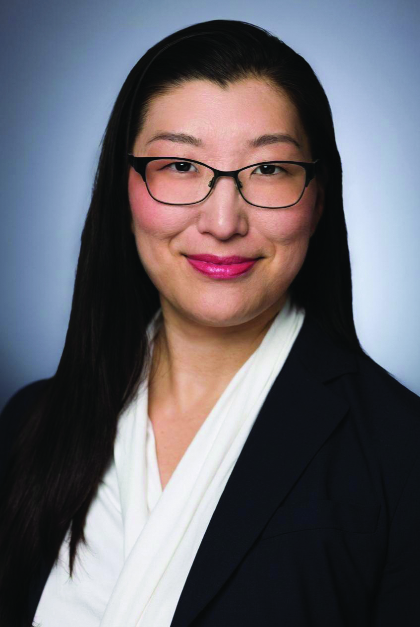 Woman with dark hair, glasses