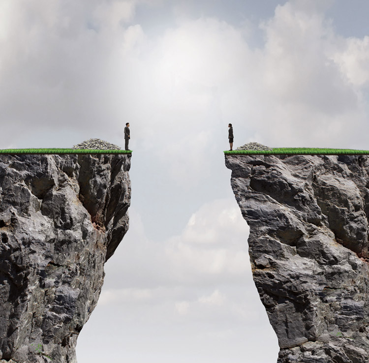 Man and woman standing on cliffs