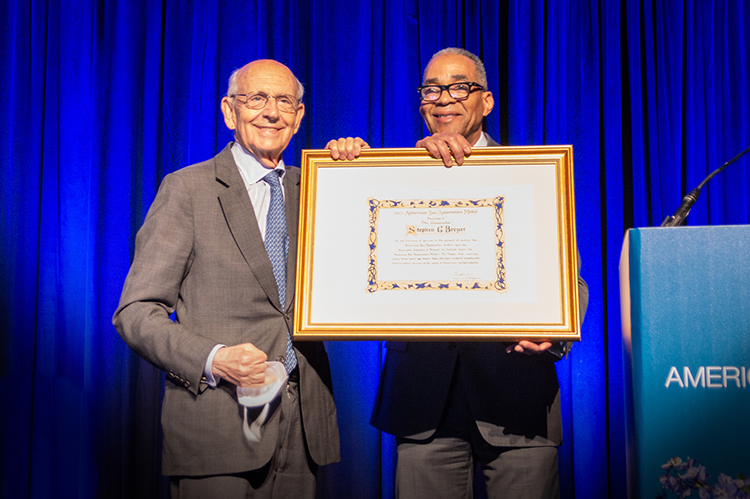 Justice Stephen Breyer accepts the ABA Medal from ABA President Reggie Turner