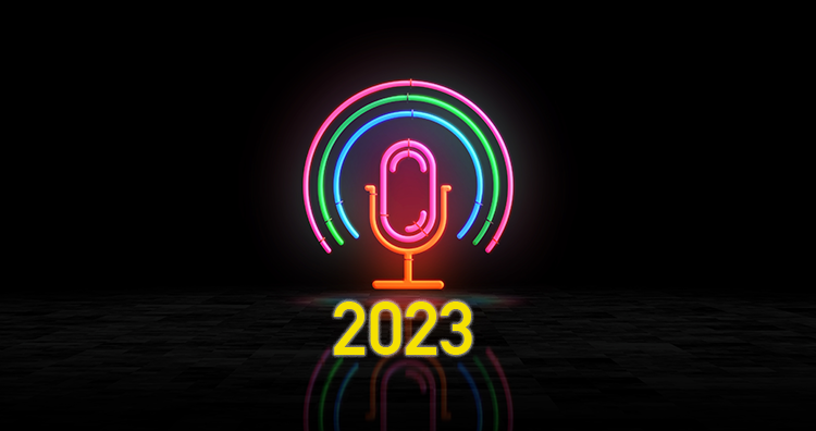 A glowing neon podcast mic sign with the year 2023 superimposed on in