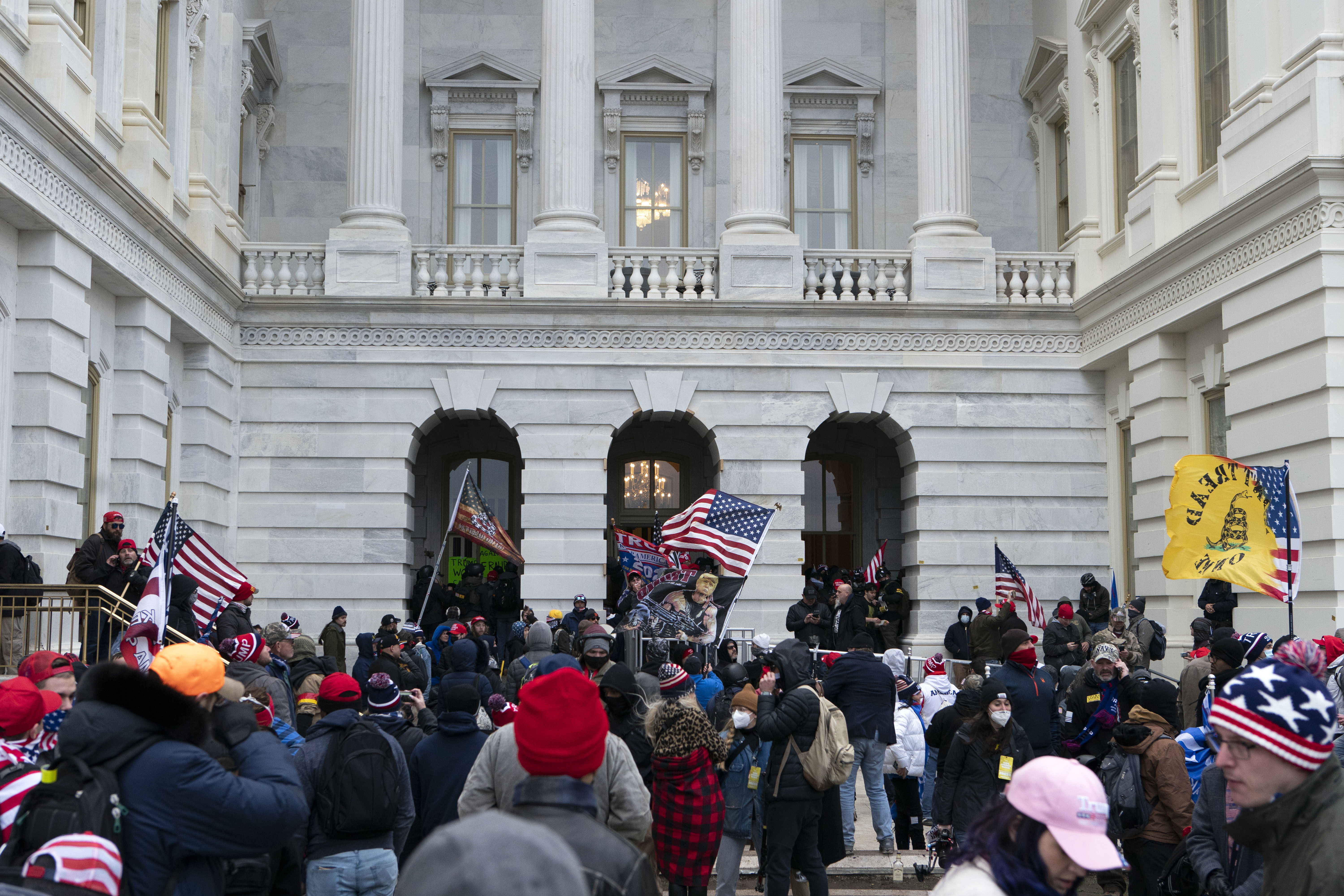 Supporters of President Donald Trump stand outside the U.S. Capitol on Wednesday, Jan. 6, 2021, in Washington.