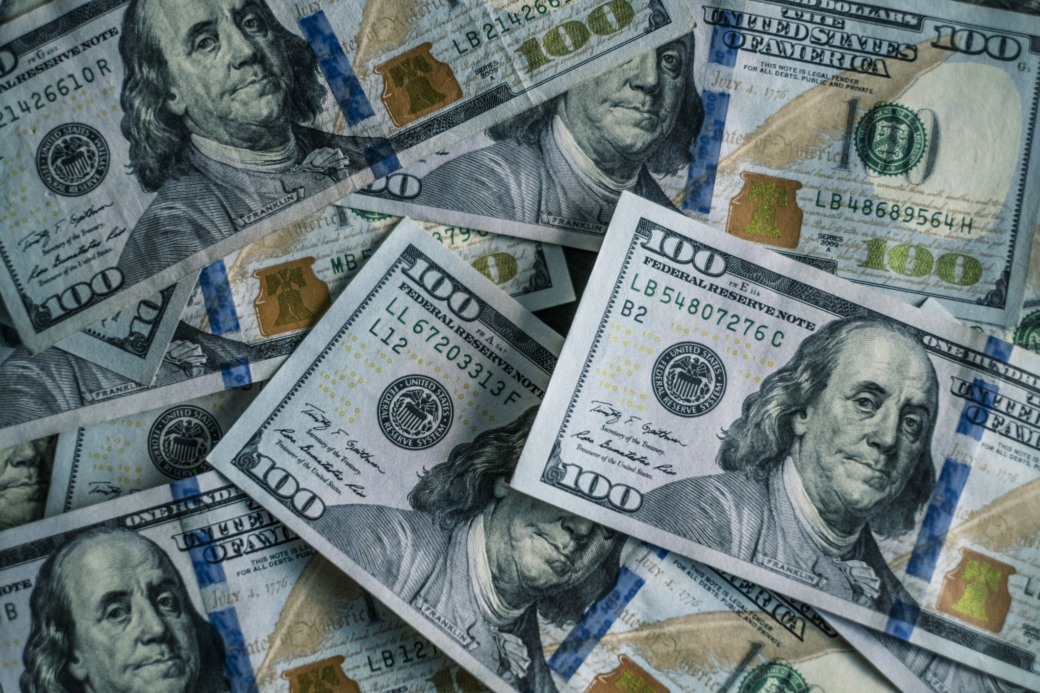Cash pile of 100 dollar bills