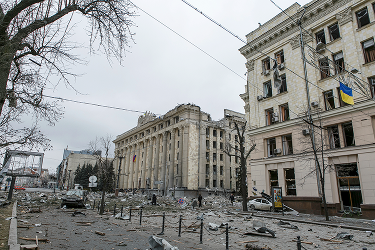 Destroyed government buildings and a Ukrainian flag
