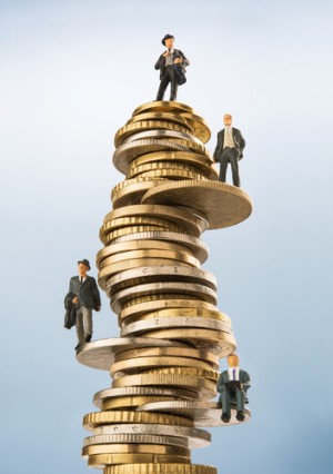 Tiny lawyers standing on a stack of coins