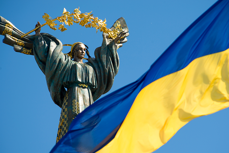 Independence monument and Ukraine flag