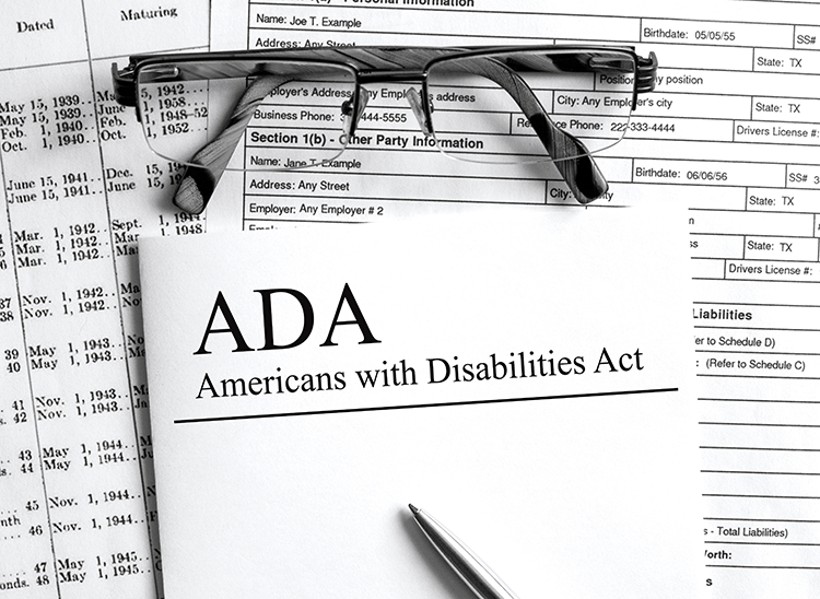 ADA paperwork with a pair of glasses on top of it