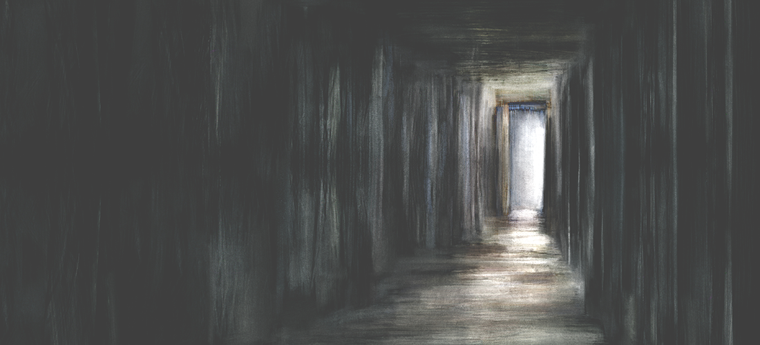 A creepy looking doorway at the end of a shadowy hallway