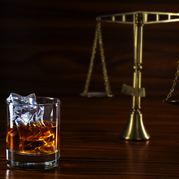alcohol and the scales of justice.