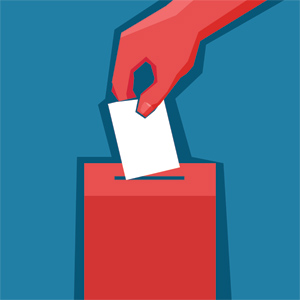Hand putting a ballot into an election box