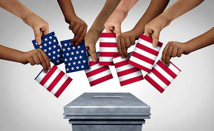 hands placing pieces of the American flag in a ballot box