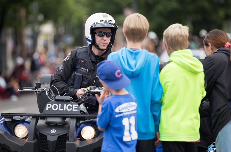 Children and a motorcycle cop