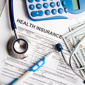 Health insurance paperwork and money