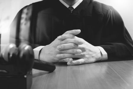 judge hands with gavel in black and white