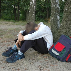 Sad boy with backpack