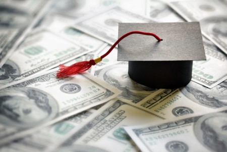 scholarship concept with money and graduation hat