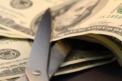 money cutting with scissors