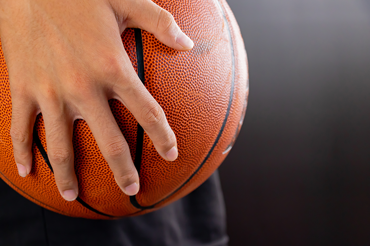 Teenager holding a basketball