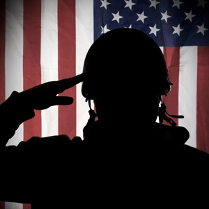 Soldier saluting the flag.